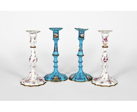 A pair of Staffordshire enamel candlesticks, c.1770, of spiral moulded form, painted in puce camaieu with sprays of flowers a
