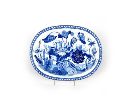 A Wedgwood blue and white transferware charger, c.1810, boldly decorated with the botanical Waterlily pattern, broken and res