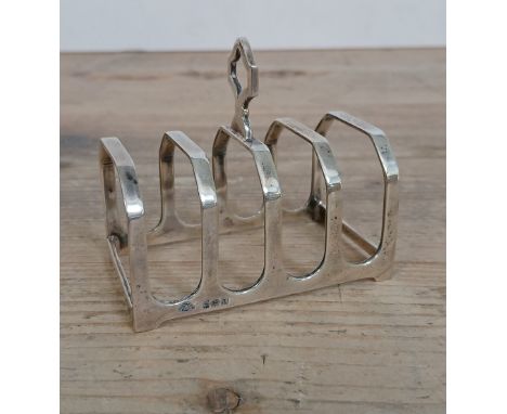 A silver toast rack, Adie Brothers, Birmingham 1933, length 8cm, weight 2oz 3dwt.
