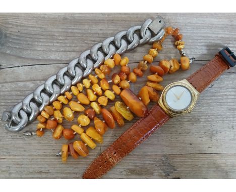 A mixed comprising two butterscotch amber bracelets, a Swatch watch and a bracelet marked '925 Mexico'.