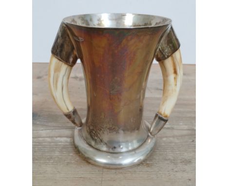 A silver tankard with boar tusk handles, Walker &amp; Hall, sheffield 1915, height 16cm, gross weight 20oz 5dwt.&nbsp;Conditi