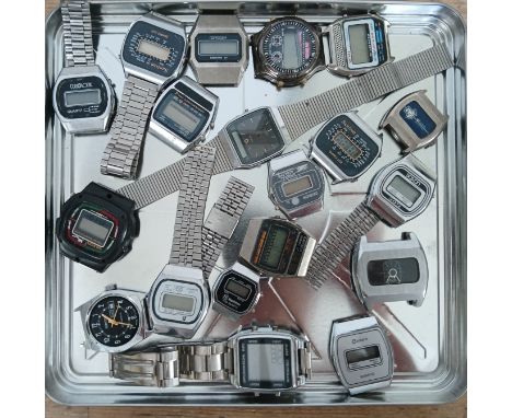 A tray of assorted digital watch parts.