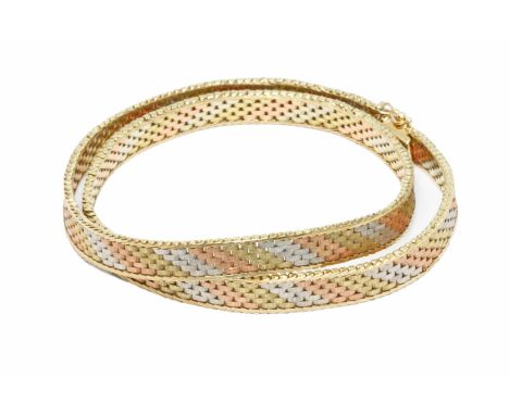 A 9ct three colour gold choker necklace, import marks, sponsor 'DJE', Edinburgh 1988, length 41cm, weight 28.6g.Condition - g