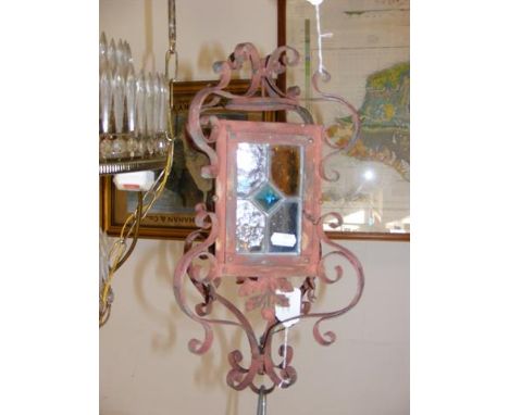 Decorative wrought iron and stained glass porch lamp 