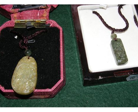 A jade pendant on chain, together with one other 