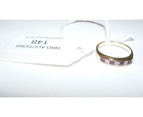 A ruby and diamond ring in 9ct gold setting (Size M 1/2) 