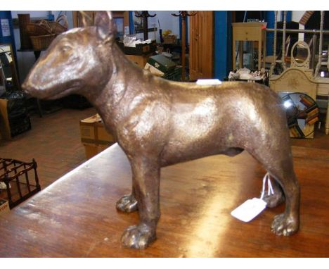 A 24cm high bronze style dog 