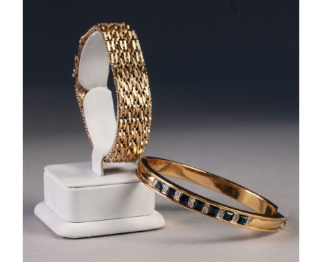 GOLD PLATED BROAD FLEXIBLE BRACELET and a gold plated hinge opening BANGLE, the top set with seven square cut synthetic sapph