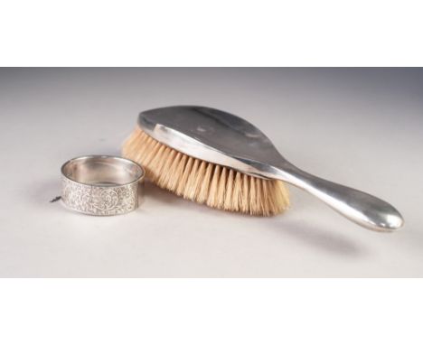 VICTORIAN ENGRAVED SILVERED COLOURED METAL BROAD HINGE OPENING BANGLE AND A LADY'S SILVER DRESSING TABLE SILVER BACKED HAIR B