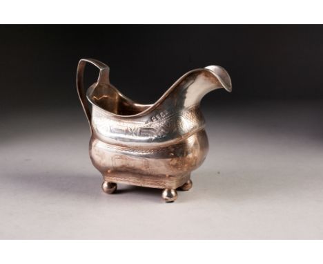 WILLIAM IV SILVER MILK JUG, of bulbous rounded oblong form with a waisted girdle, wriggle engraved decoration, strap handle, 