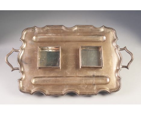 GEORGE V IMPRESSIVE SILVER PRESENTATION TWO HANDLED TRAY PATTERN DESK STAND BY THOMAS BRADBURY &amp; SONS, of shaped, oblong 