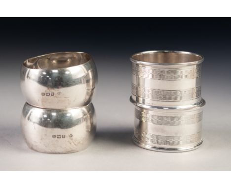 GEORGE V PAIR OF PLAIN SILVER NAPKIN RINGS, Birmingham 1911, together with ANOTHER PAIR, ENGINE TURNED, stamped 'SILVER', 3oz