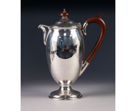 PRE-WAR SILVER COFFEE POT of oviform with composition handle and knop, rising from a stem foot, Birmingham 1934 13 1/2oz gros