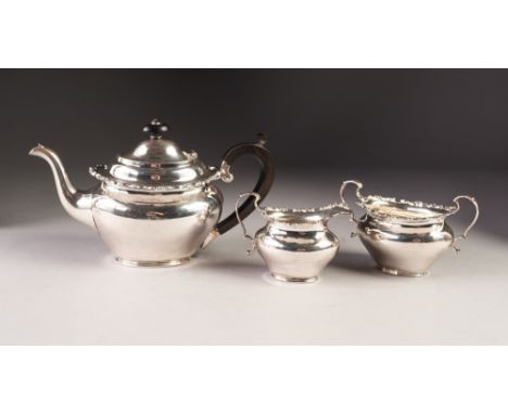 EDWARD VII BACHELORS THREE PIECE SILVER TEA SET BY ELKINGTON &amp; Co, of plain oval form with cyma borders, Birmingham 1909,