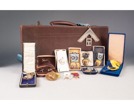 NINE MASONIC GILT METAL AND ENAMEL MEDALLIONS, some in original boxes and a SELECTION MASONIC REGALIA, including sash with la