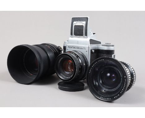 A Pentacon Six TL SLR Camera and Carl Zeiss Jena Lenses, format 6 x 6cm, body F-G,waist level finder, shutter working, sluggi