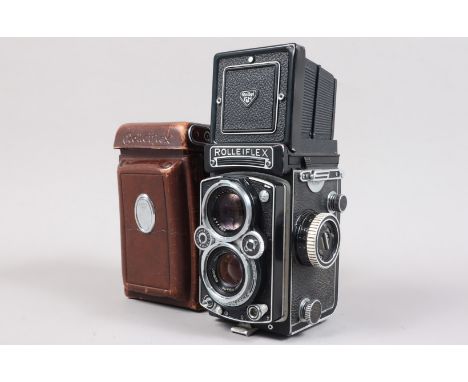 A Rolleiflex 3.5 E TLR Camera, serial no 1865242, shutter working, body G, light paint wear to edges, with Schneider Kreuznac
