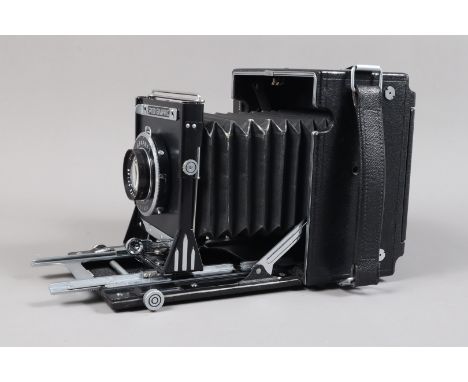 A Folmer-Graflex Black 5 x 4in Anniversary Speed Graphic Press Camera, serial no 317931, circa 1944, rising and shift front, 