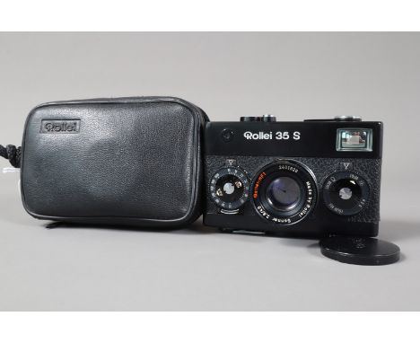 A Rollei 35 S Compact camera, black, shutter working, meter responsive, body G, tiny ding to top plate, with Rollei HFT 40mm 