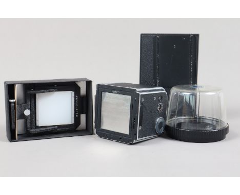 Hasselblad Accessories, comprising a boxed Hasselblad Magazine 70 for 70mm film, a Magazine 100 for Polaroid film a boxed Tra
