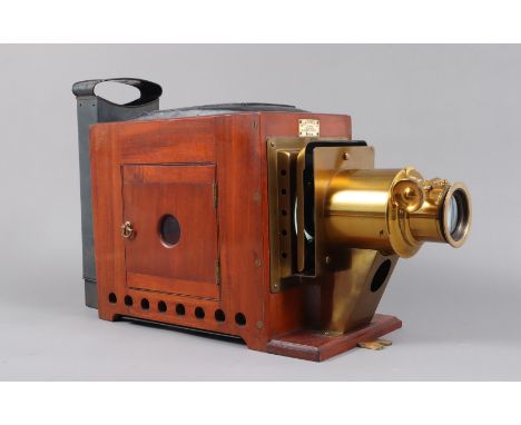 An early 20th Century Mahogany and Brass Newton and Co Magic Lantern,  with original wooden case, G-VG, lacks chimney and ill