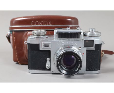 A Zeiss Ikon Contax IIIa Rangefinder Camera, serial no B 86037, post 1954 model, body G, spotting to base plate, shutter not 