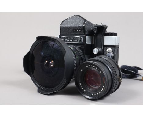 A Kiev 60 TTL SLR Camera and Two Lenses, serial no 9209621, format 6 x 6cm, eye-level viewfinder, with detachable accessory s