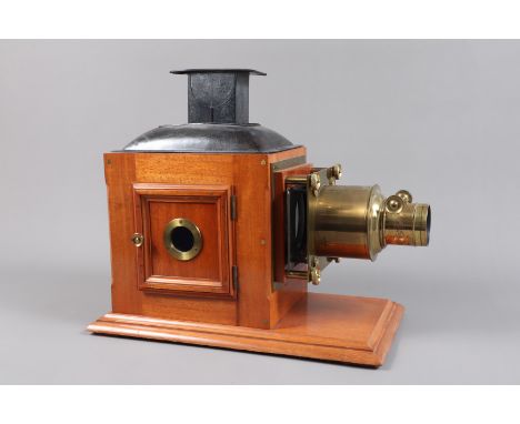 A late 19th Century Butcher &amp; Son Mahogany and Brass Magic Lantern,  with fielded door, now fitted with Wrench 'The Impro