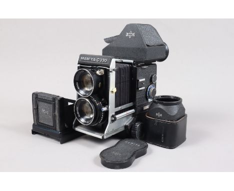 A Mamiya C330 Professional TLR Camera, serial no D59217, body G-VG, bellows VG, light wear, all functions smoothly, with Mami