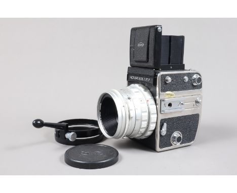 A Kowa Six MM SLR Camera, format 6 x 6cm, body G, wear to base plate, door edge and owner's serial number label on base, shut