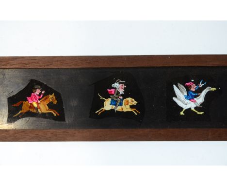 Mahogany-Mounted Magic Lantern Slides,  mid to late 19th Century copper-plate/transfer print hand-coloured long slides, comic