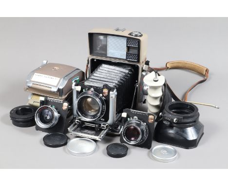 A Linhof Technika 70 Camera Outfit, viewfinder clear, focu/rangefinder functions, body G, some wear to edges, some tape resid