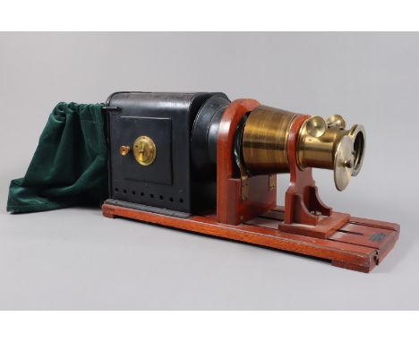 An early 20th Century Black-Painted Iron and Brass Magic Lantern,  with retailer's plate for 'Reynolds &amp; Branson Ltd, 14 