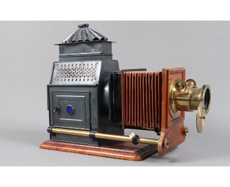A late 19th Century Russian Iron Mahogany and Brass Magic Lantern,  with bellows and pierced-work illuminant housing of simil