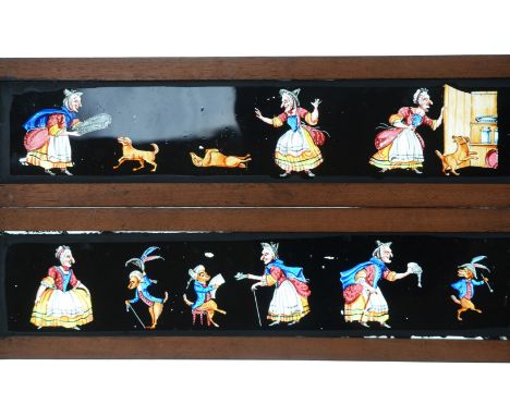 Mahogany-Mounted Magic Lantern Slides,  mid to late 19th Century copper-plate/transfer print hand-coloured long slides, comic
