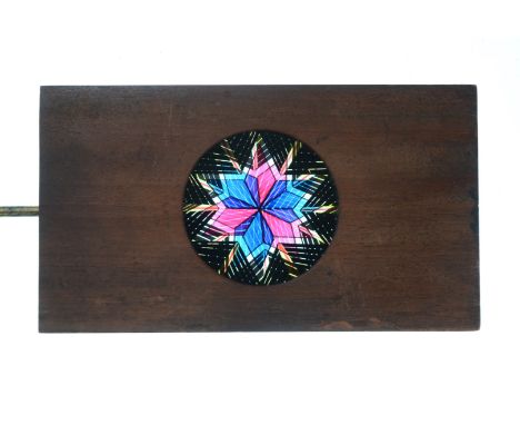 Mahogany-Mounted Magic Lantern Slides,  hand-coloured rackwork chromatropes or artificial fireworks - star pattern (1), starb