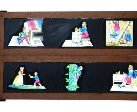 Mahogany-Mounted Magic Lantern Slides,  mid to late 19th Century copper-plate/transfer print hand-coloured long slides, comic