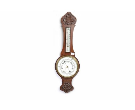 EDWARDIAN WHEEL BAROMETER AND THERMOMETER
with opaque white glass dials, contained in a mahogany case with floral cresting an