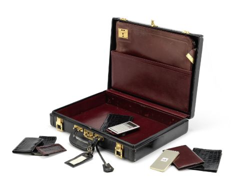 Briefcase, folio, and covers,Hermes, 1970's,To include a black hardsided briefcase with gold tone hardware, c.1976, a Rouge H