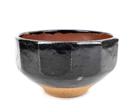 Bernard Howell LEACH (1887-1979) A stoneware cut sided bowl with Tenmoku glaze.  Impressed with personal and Leach Pottery se