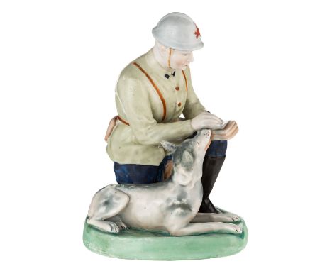 A LARGE RUSSIAN PORCELAIN FIGURE OF A RED ARMY SIGNALMAN WITH SERVICE DOG, GORODNITSKY PORCELAIN FACTORY, GORODNITSA, LATE 19
