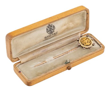 A FABERGE GOLD, DIAMOND AND ENAMEL TIE PIN, WORKMASTER AUGUST HOLLMING, ST. PETERSBURG, 1899-1904 featuring an Imperial eagle