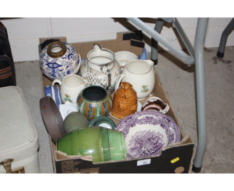 A box of mixed china to include a green glazed jug, a silver lustre jug, and a blue and white oil lamp reservoir etc.