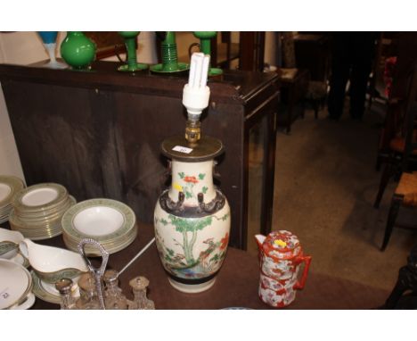 A modern Chinese vase converted to a table lamp, decorated with exotic birds 