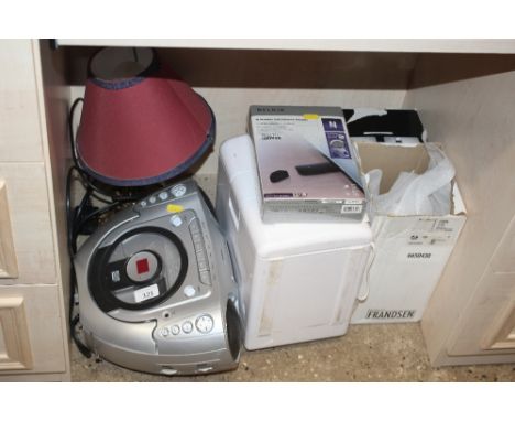 A Goodmans CD cassette recorder; a wireless receiver; a table lamp; a wireless USB; and a table top fridge