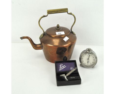 A copper kettle, alarm clock and a razor