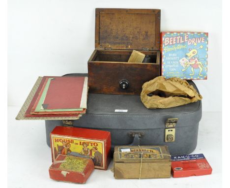 A quantity of games, in suitcase, including chess, beetledrive, snakes and ladders and other items