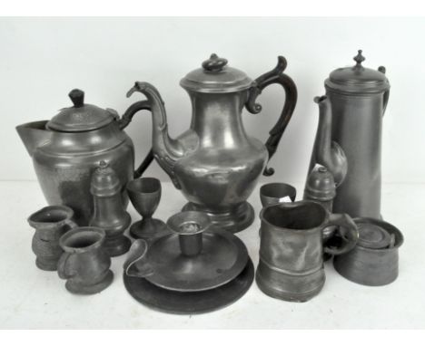A large collection of assorted pewter, to include a chamber stick, tea pots, measuring cups and more