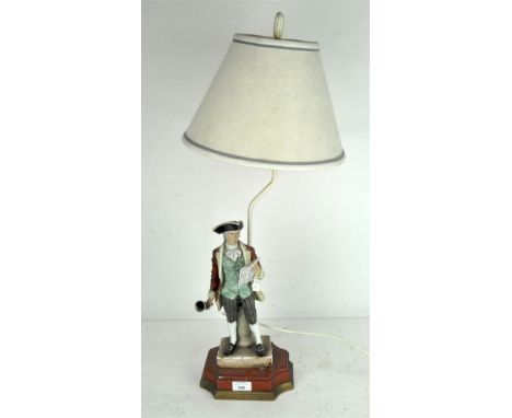 A Continental porcelain figure of a Town Crier, mounted as a table lamp, approximately 53cm high