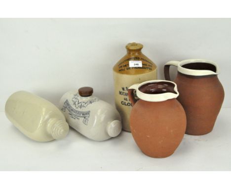 A group of stoneware jugs and jars, including a botanical brewers jar from W S Griffin &amp; Son, 28cm high